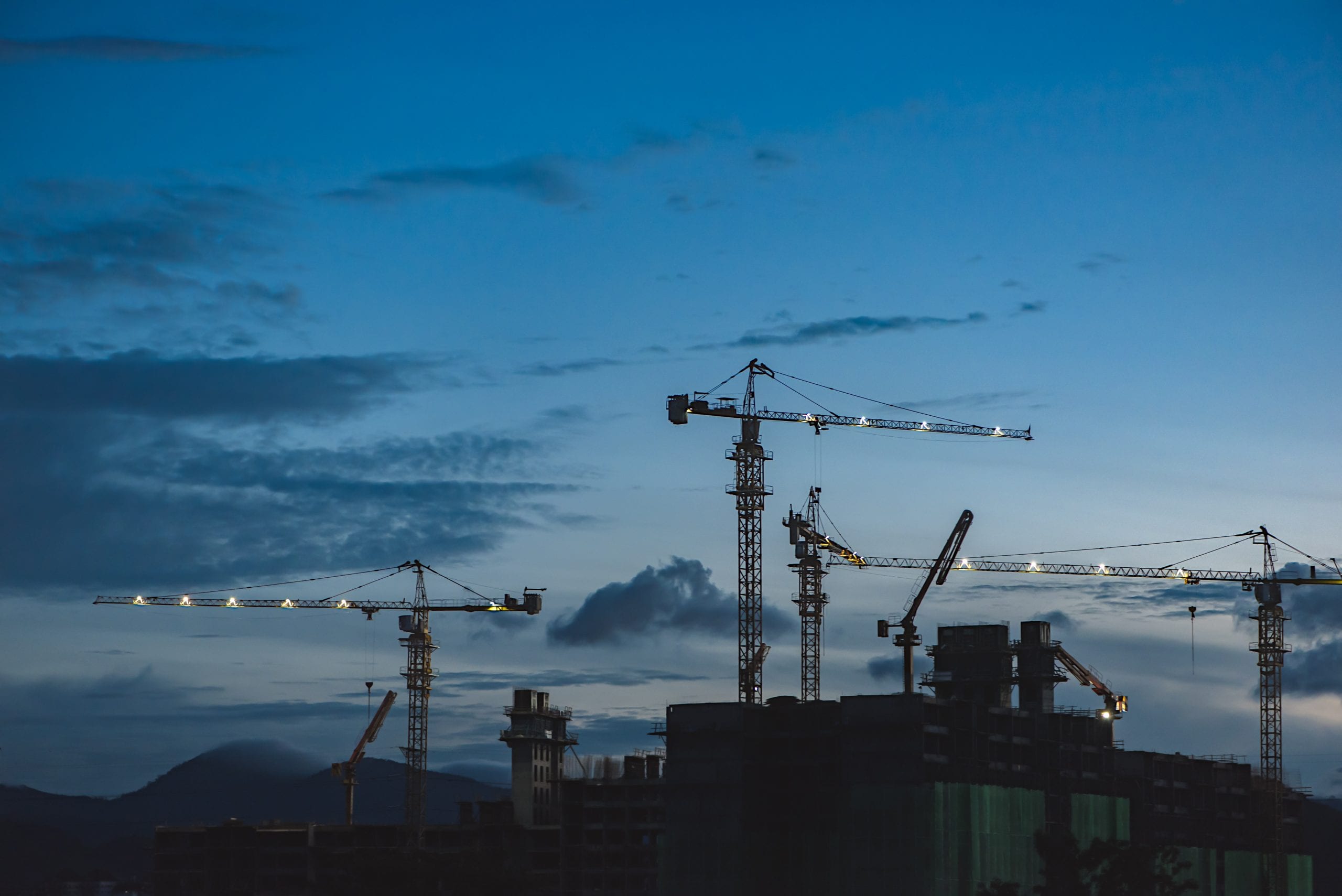 PJ Personnel Recruitment Agency stock image of a construction site with cranes.